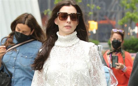 Anne Hathaway Wears Bold Snakeskin Boots With ’70s.